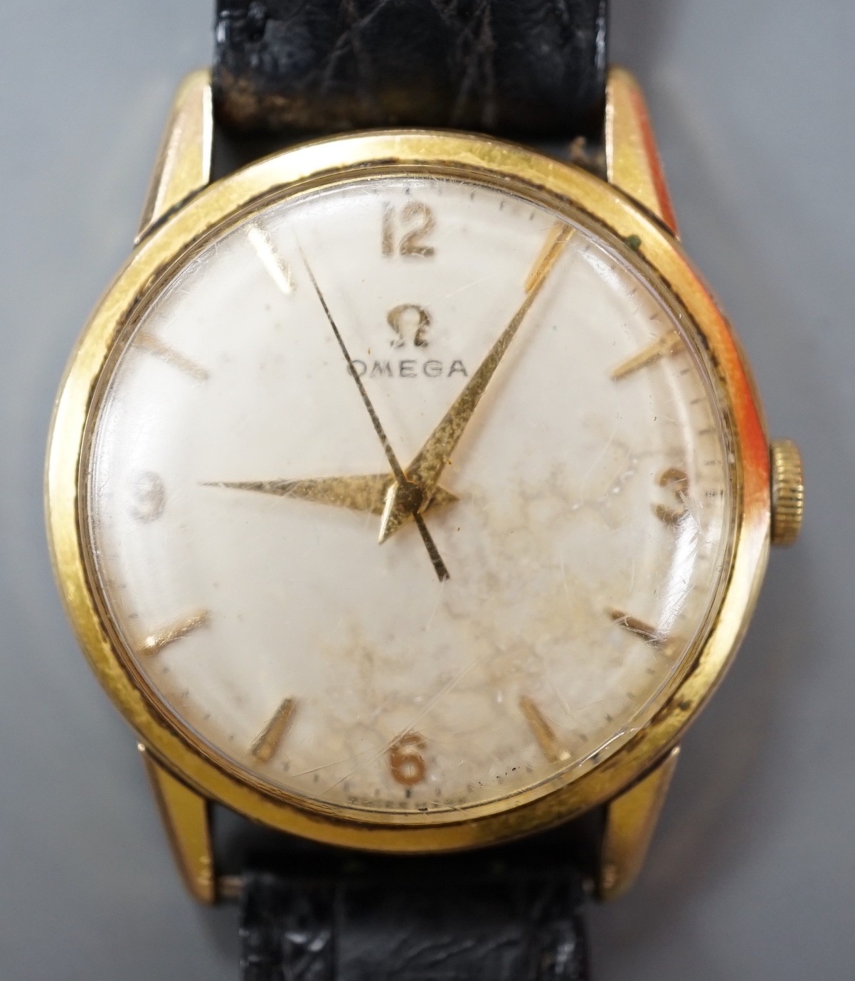 A gentleman's steel and gold plated Omega manual wind wrist watch, on associated leather strap.